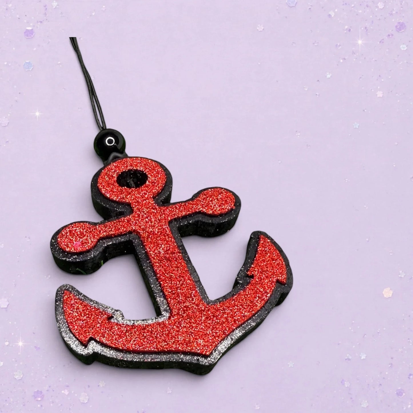 BeFreshie red glitter anchor car freshener with black trim and hanging string.