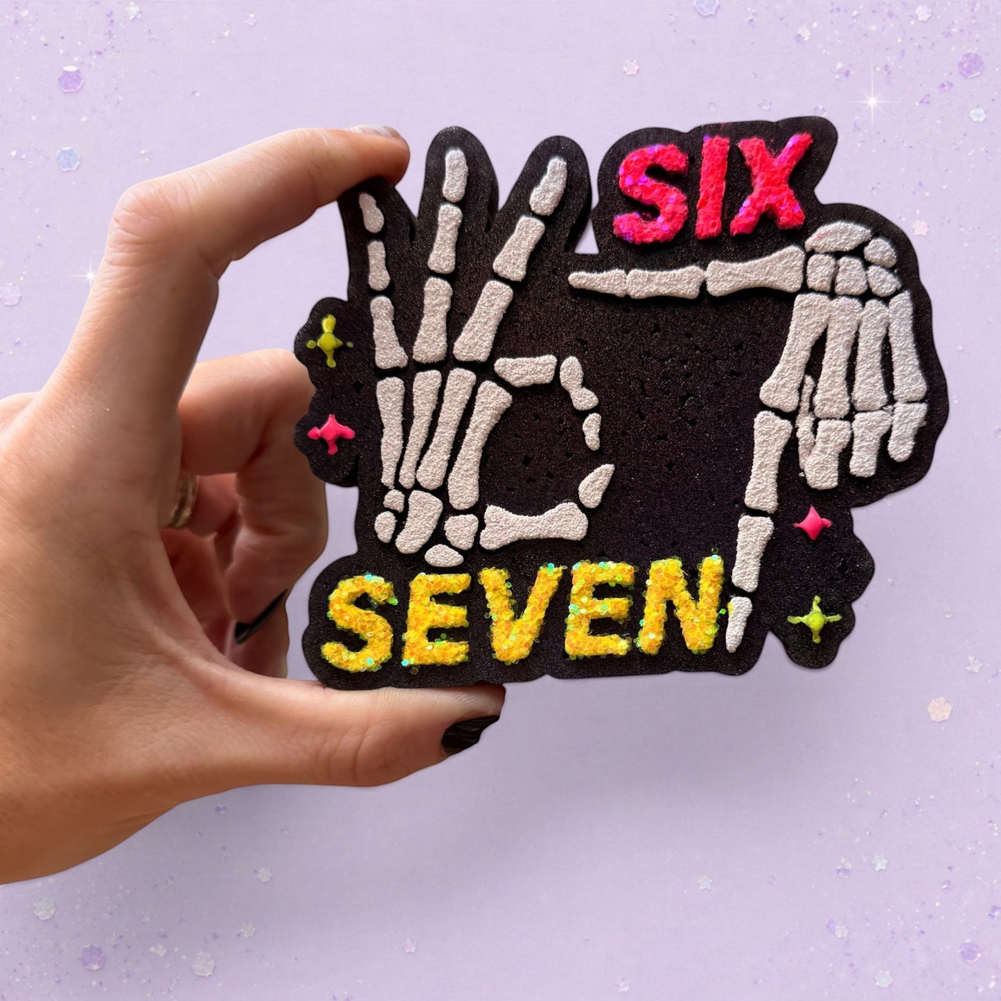 BeFreshie Six Seven car air freshener featuring skeleton hands making a hand sign with neon pink and yellow text