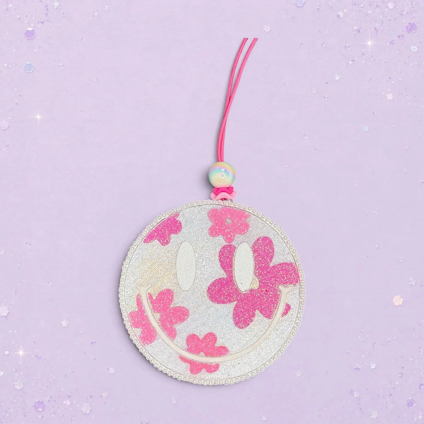BeFreshie large smiley face freshie with pink glitter daisies and a beaded string.
