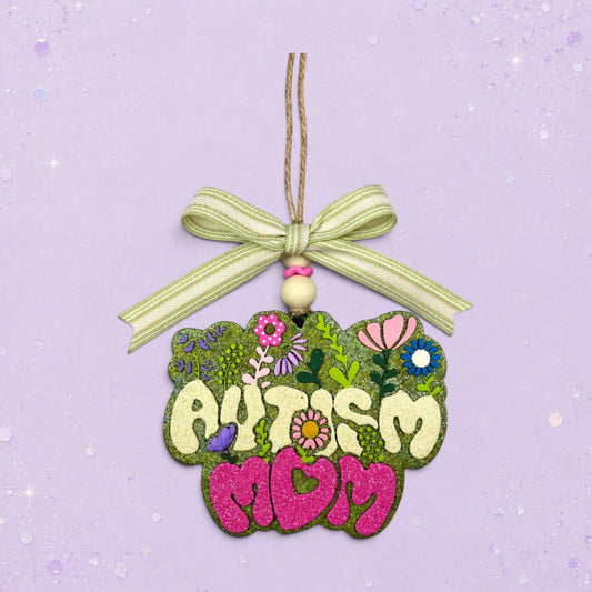 BeFreshie Autism Mom freshie with glittery green floral background and pink glitter letters.