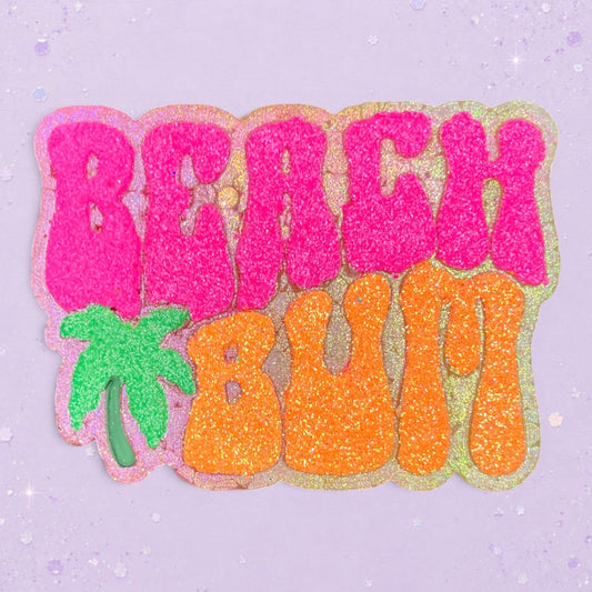BeFreshie Beach Bum car air freshener with glittery pink and orange text and a green palm tree icon