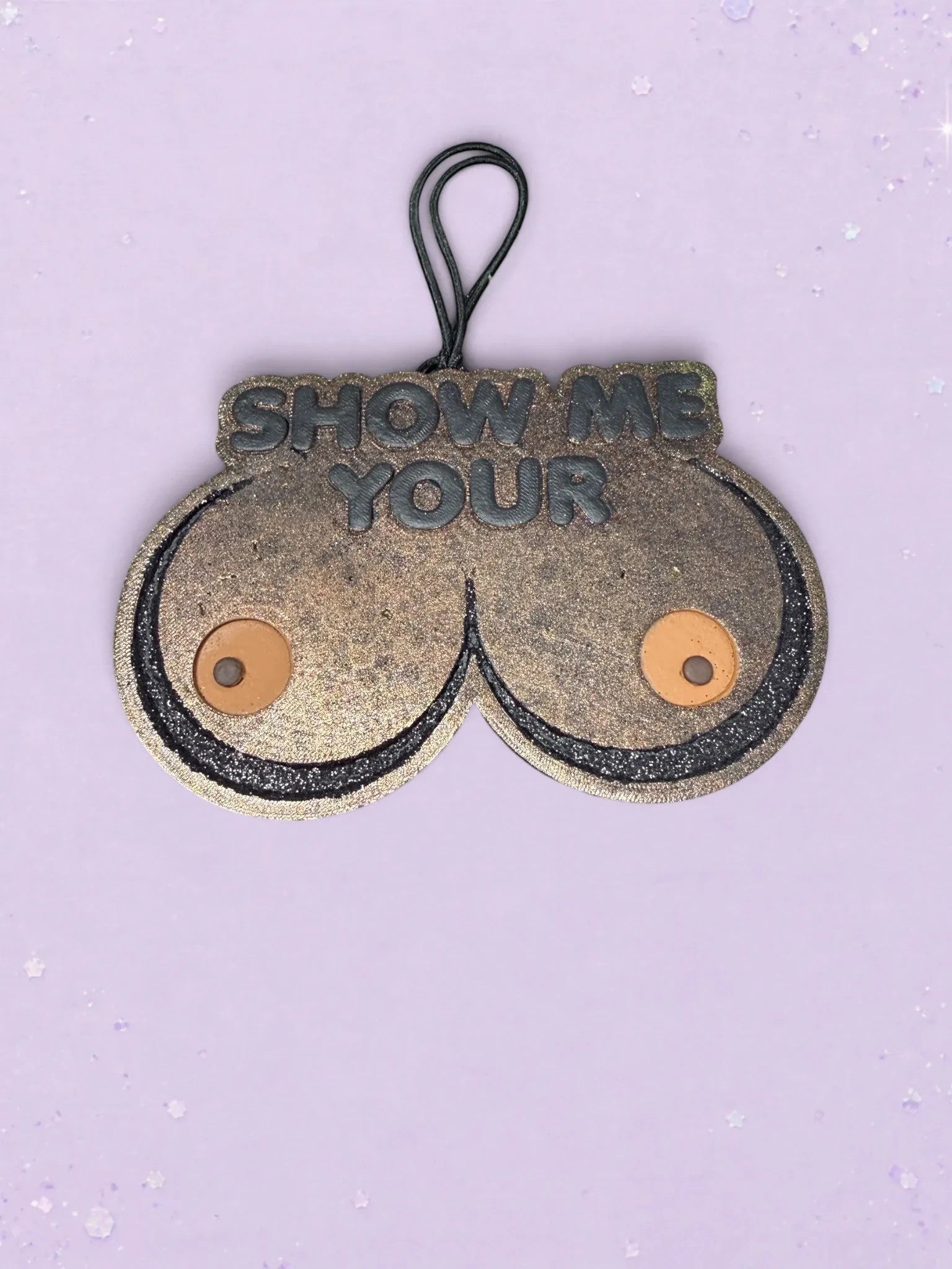 BeFreshie Show Me Your **** car air freshener in a glittery bronze finish with a black hanging cord.
