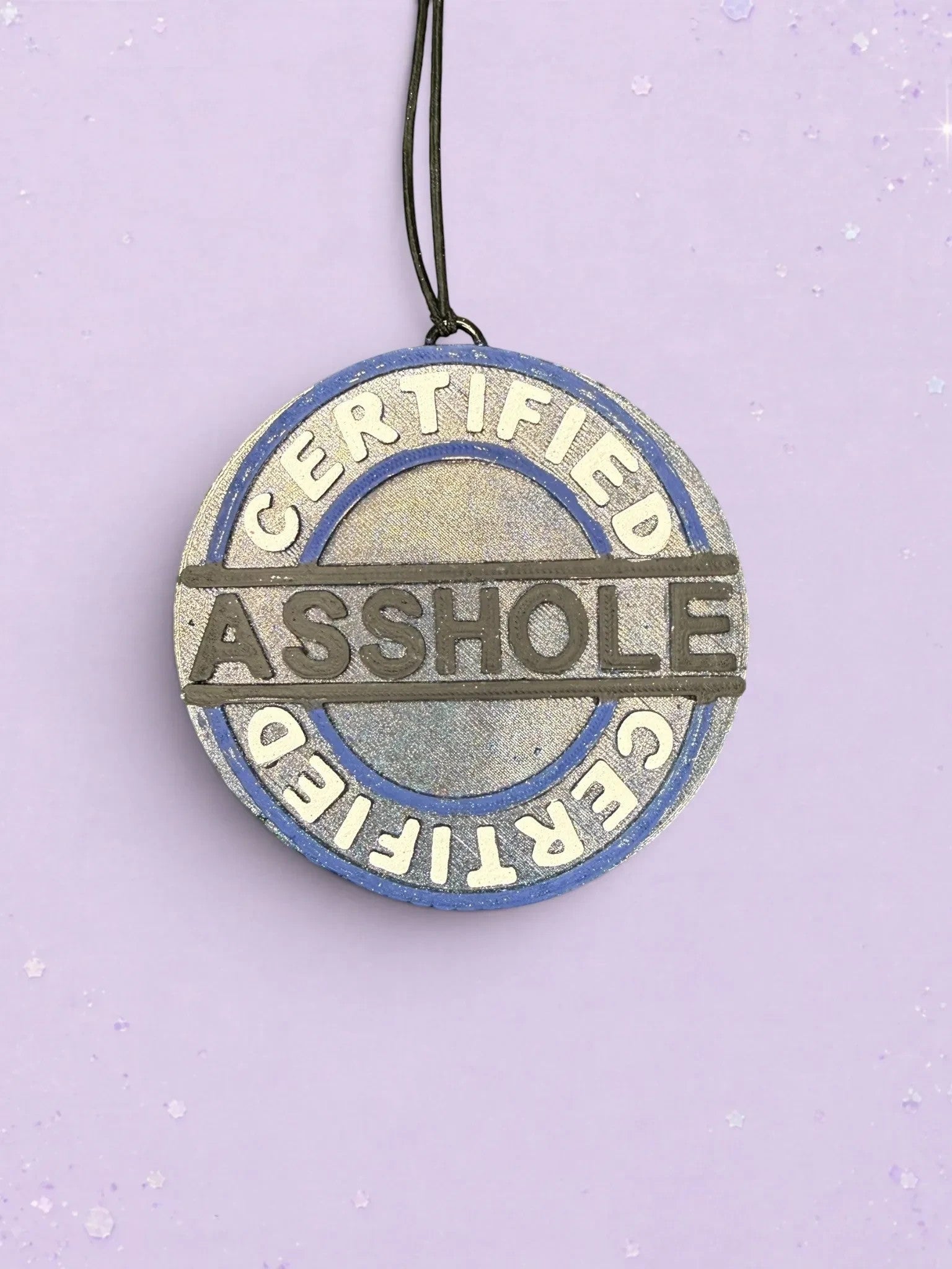BeFreshie Certified Asshole car air freshener in a round blue and silver design with bold embossed lettering.
