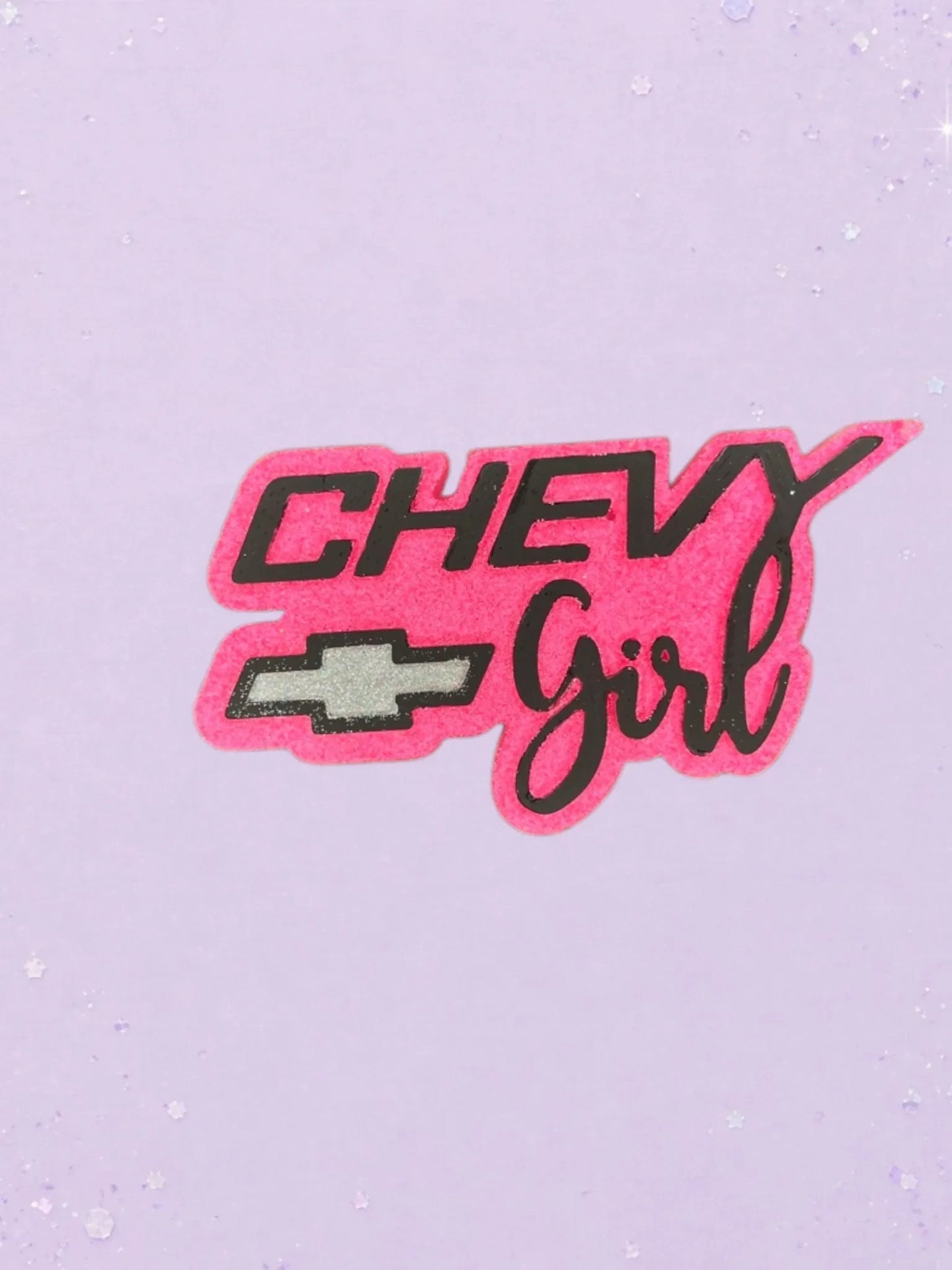 BeFreshie Chevy Girl car air freshener in hot pink and black with a silver Chevrolet logo on a light purple background