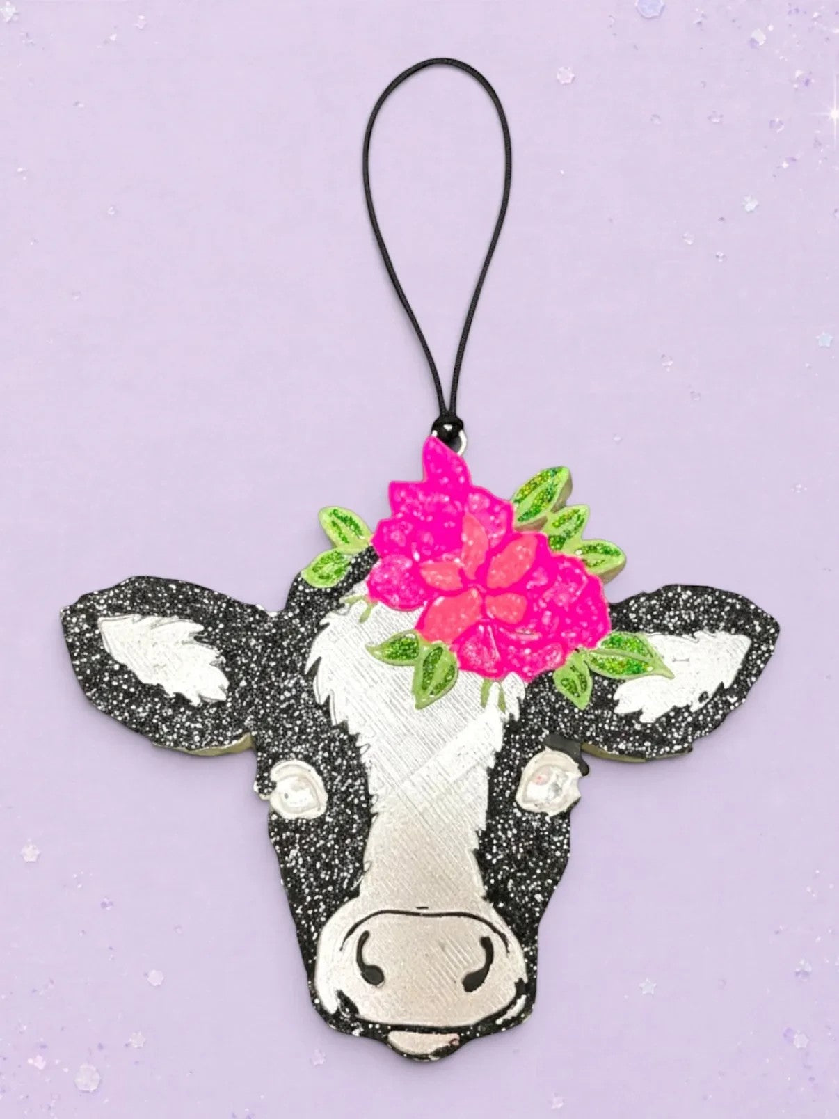 BeFreshie small cow head freshie with pink flowers and green leaves, black and white glitter accents.