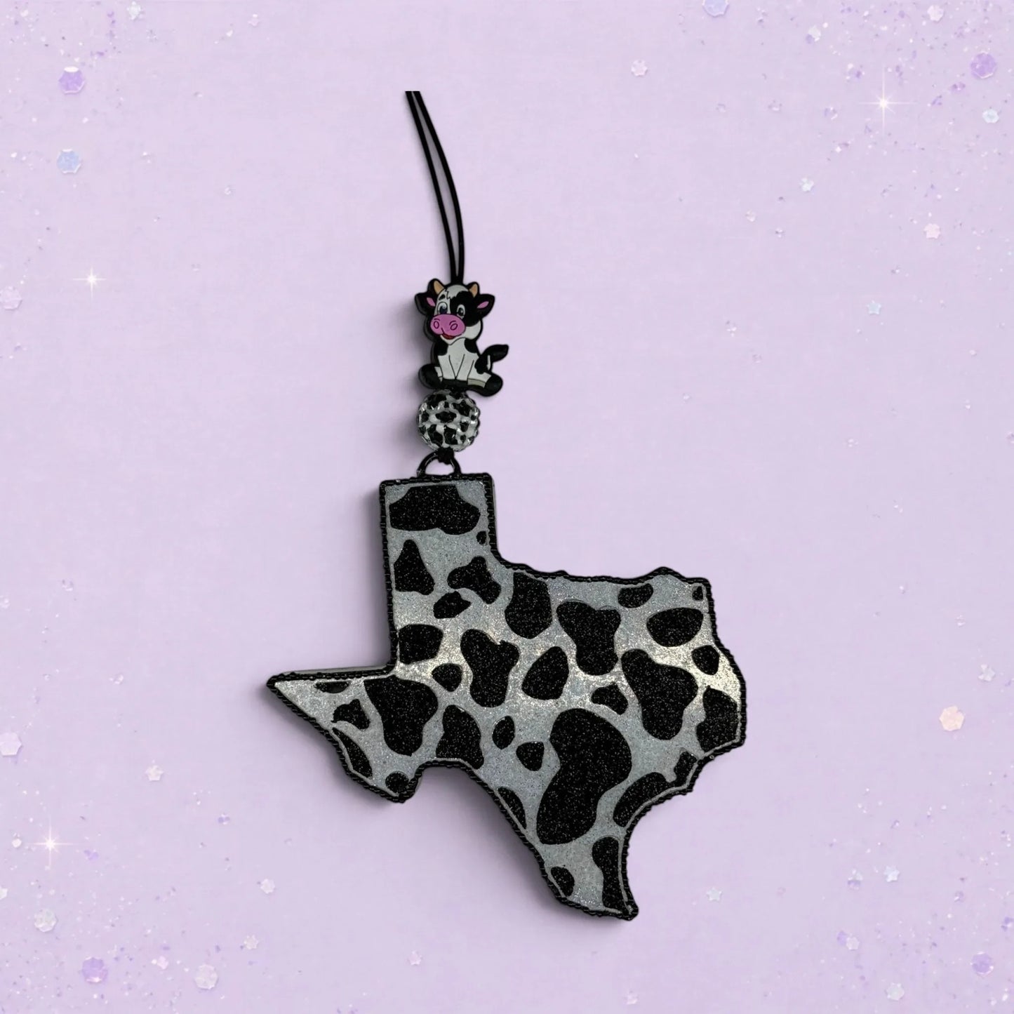 BeFreshie Cowprint Texas freshie in black and silver with a small cow charm.