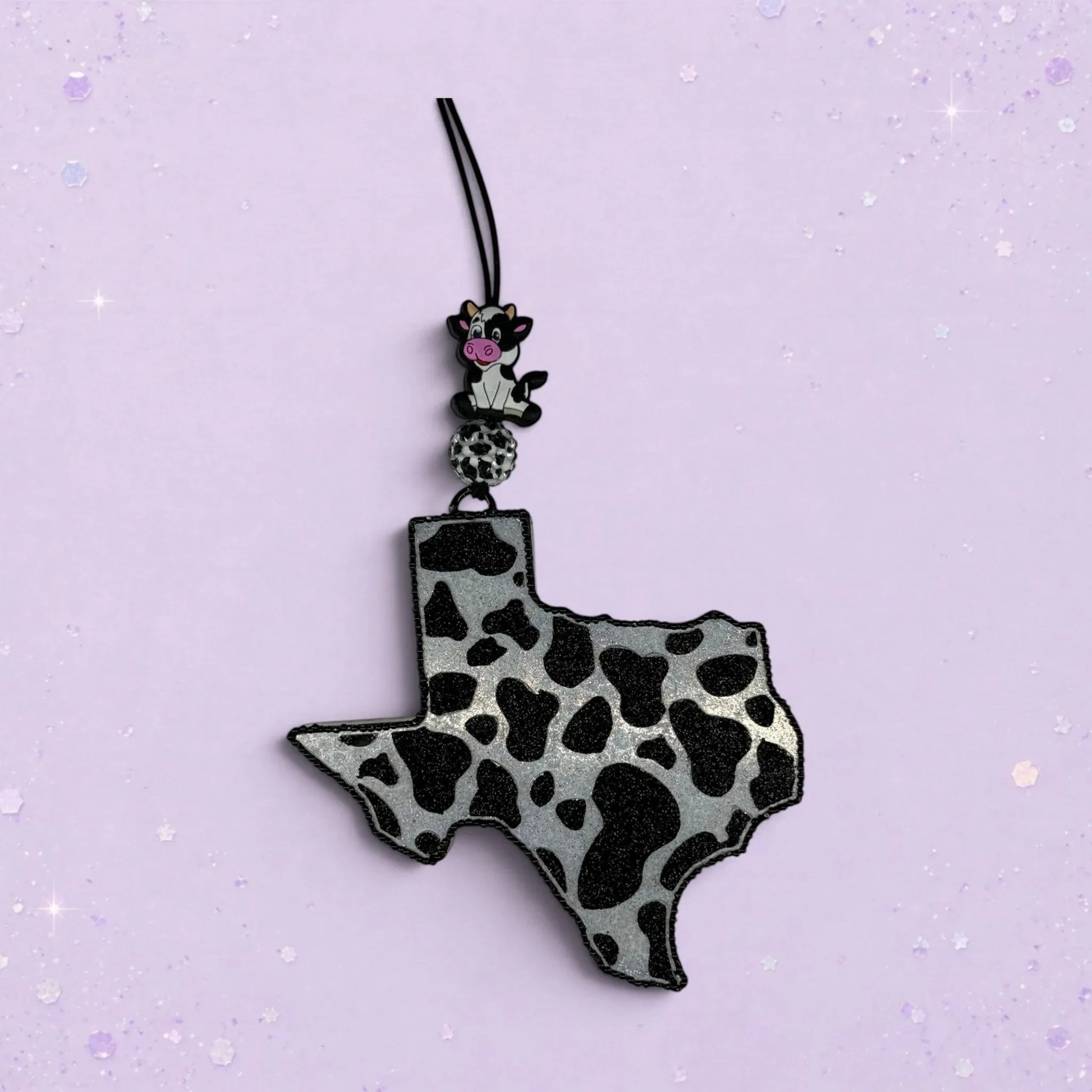 BeFreshie Cowprint Texas freshie in black and silver with a small cow charm.