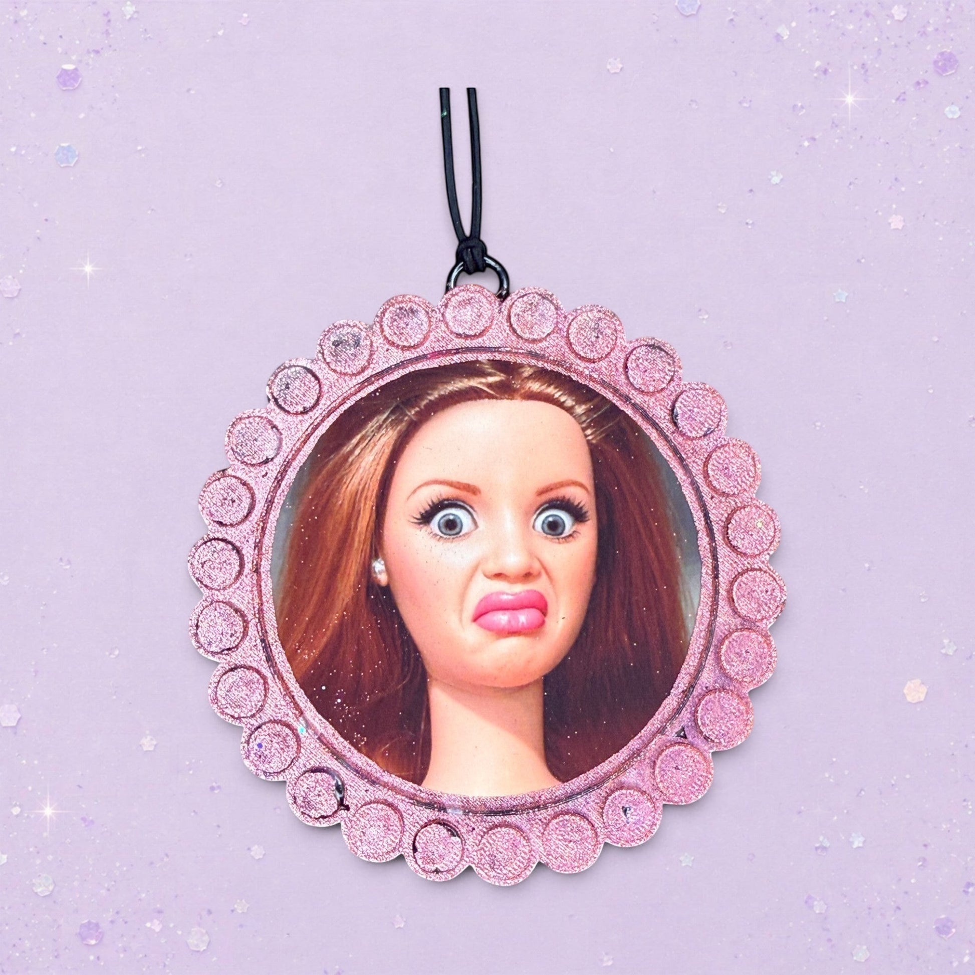 BeFreshie custom photo air freshener with a funny doll face in a pink glittery frame. Scented car accessory.