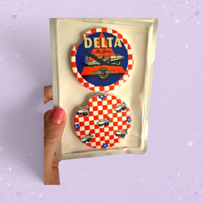 BeFreshie custom car coasters with Delta Air Lines logo and checkered pattern with airplanes.