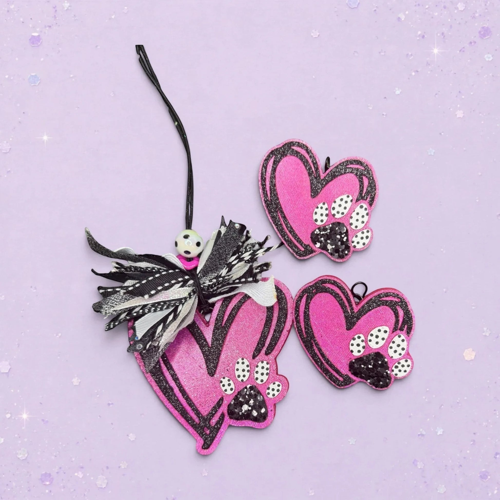 BeFreshie pink glitter heart freshies with black paw prints and decorative ribbon.