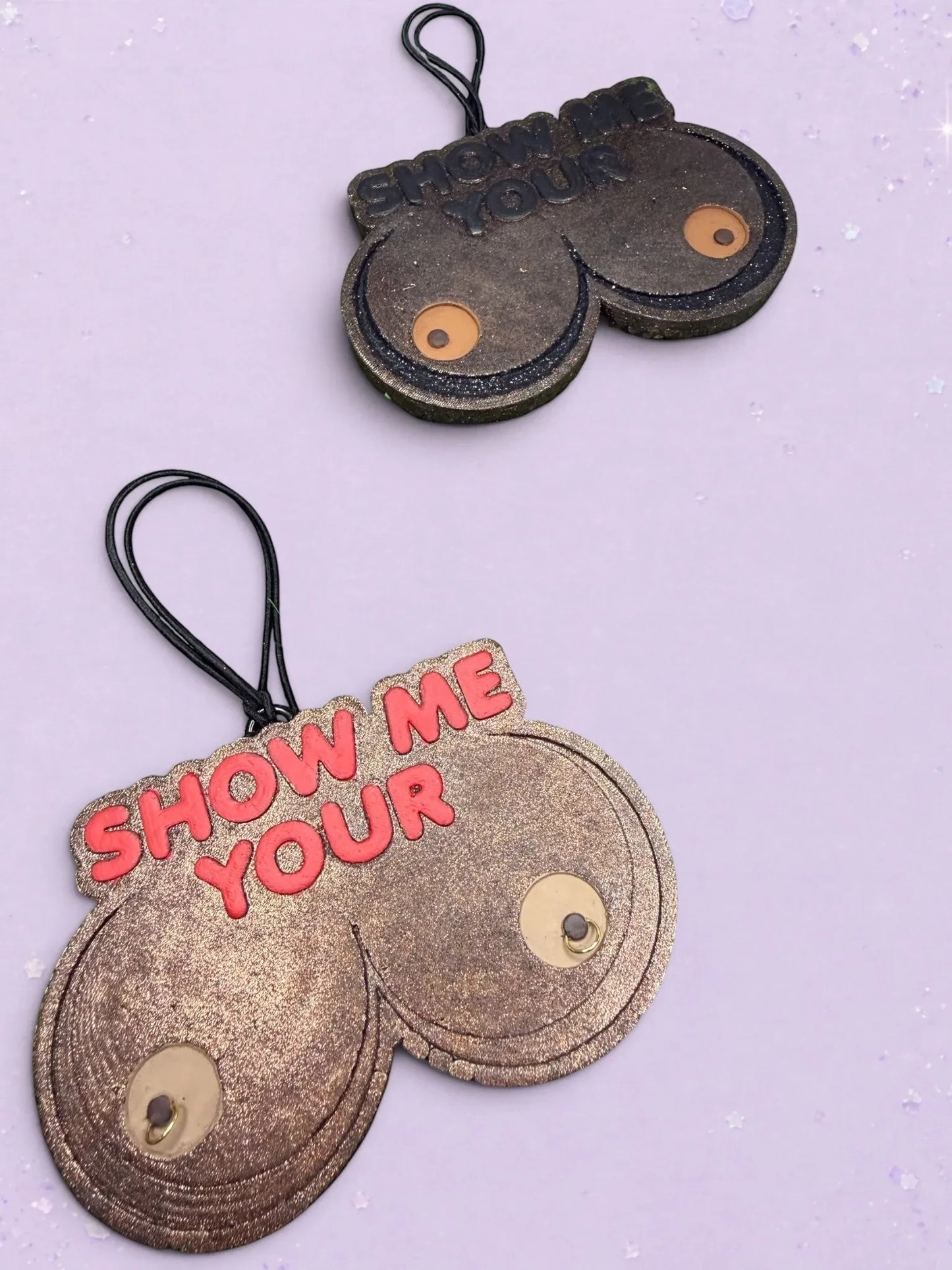 BeFreshie Show Me Your **** car air fresheners in bronze and black glitter with hanging elastic cords