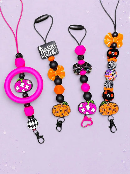 BeFreshie Halloween themed beaded hangers with pumpkins, ghosts, and bows in pink, orange, and black.