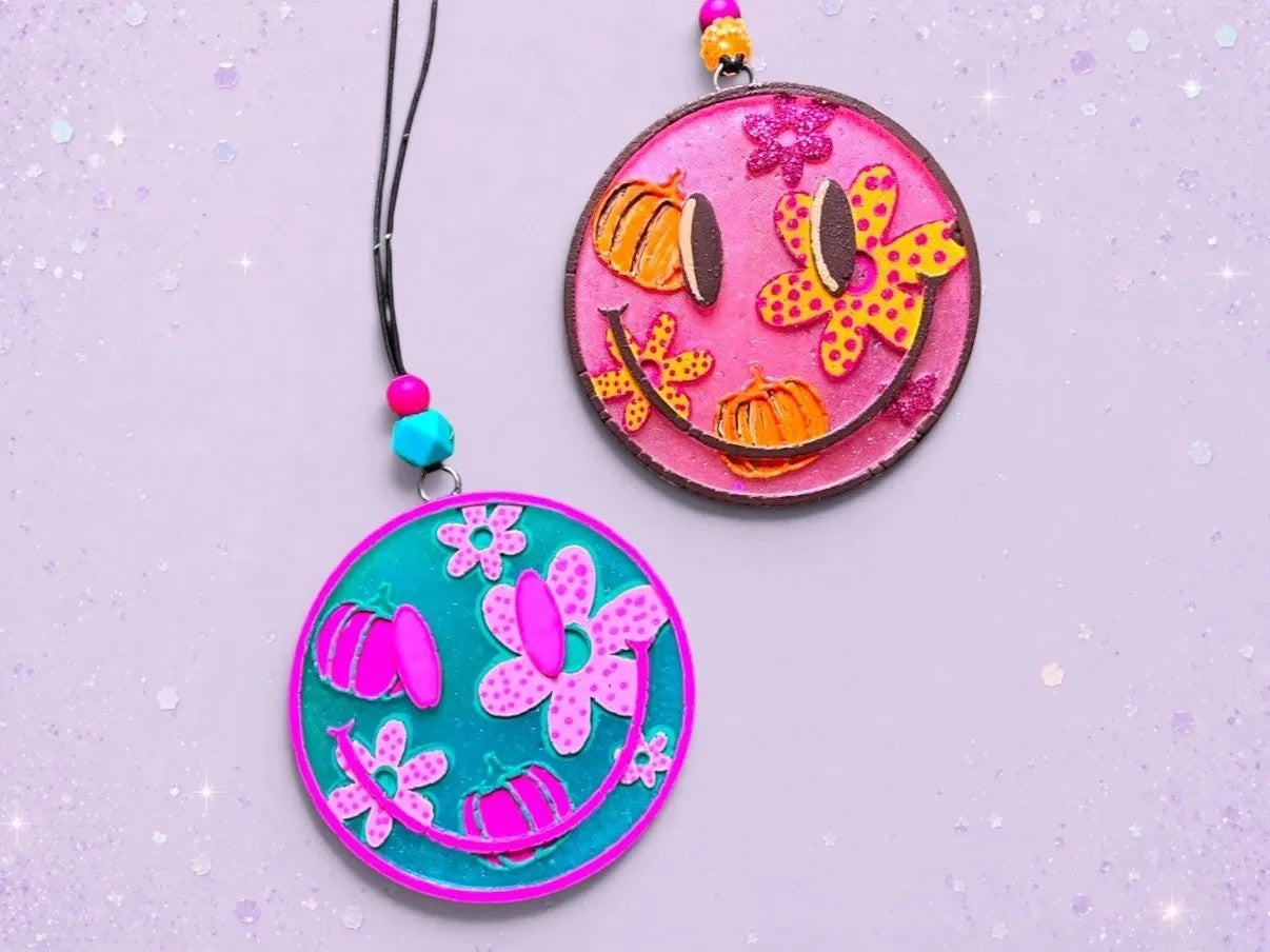 BeFreshie Happy Face Fall Theme freshies in pink and teal with pumpkins and flowers. Includes hanging string with beads.