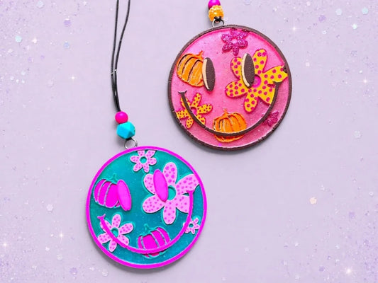 BeFreshie Happy Face Fall Theme freshies in pink and teal with pumpkins and flowers. Includes hanging string with beads.