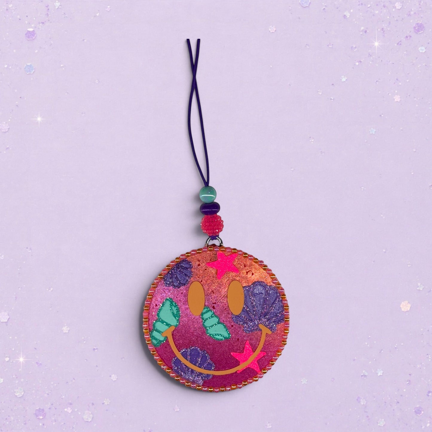 BeFreshie Happy Face Shells freshie with pink and purple swirls, shells, and stars. Features a beaded string.