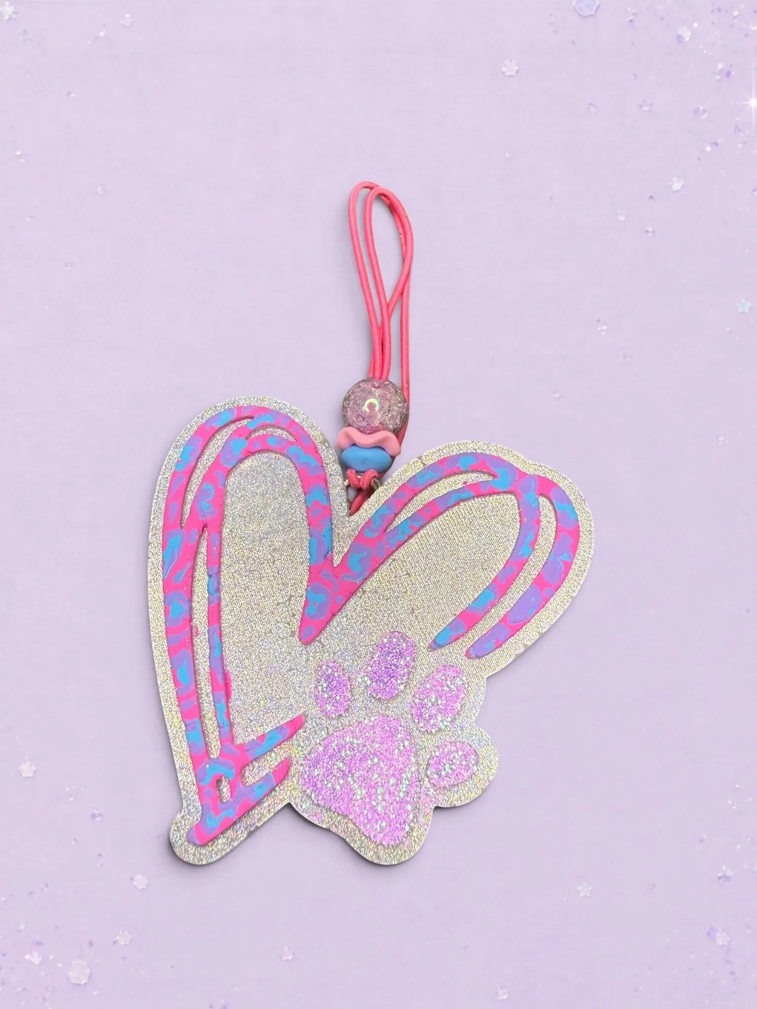 BeFreshie heart-shaped car freshie with a glittery paw print, featuring blue and pink doodle accents and a pink loop.
