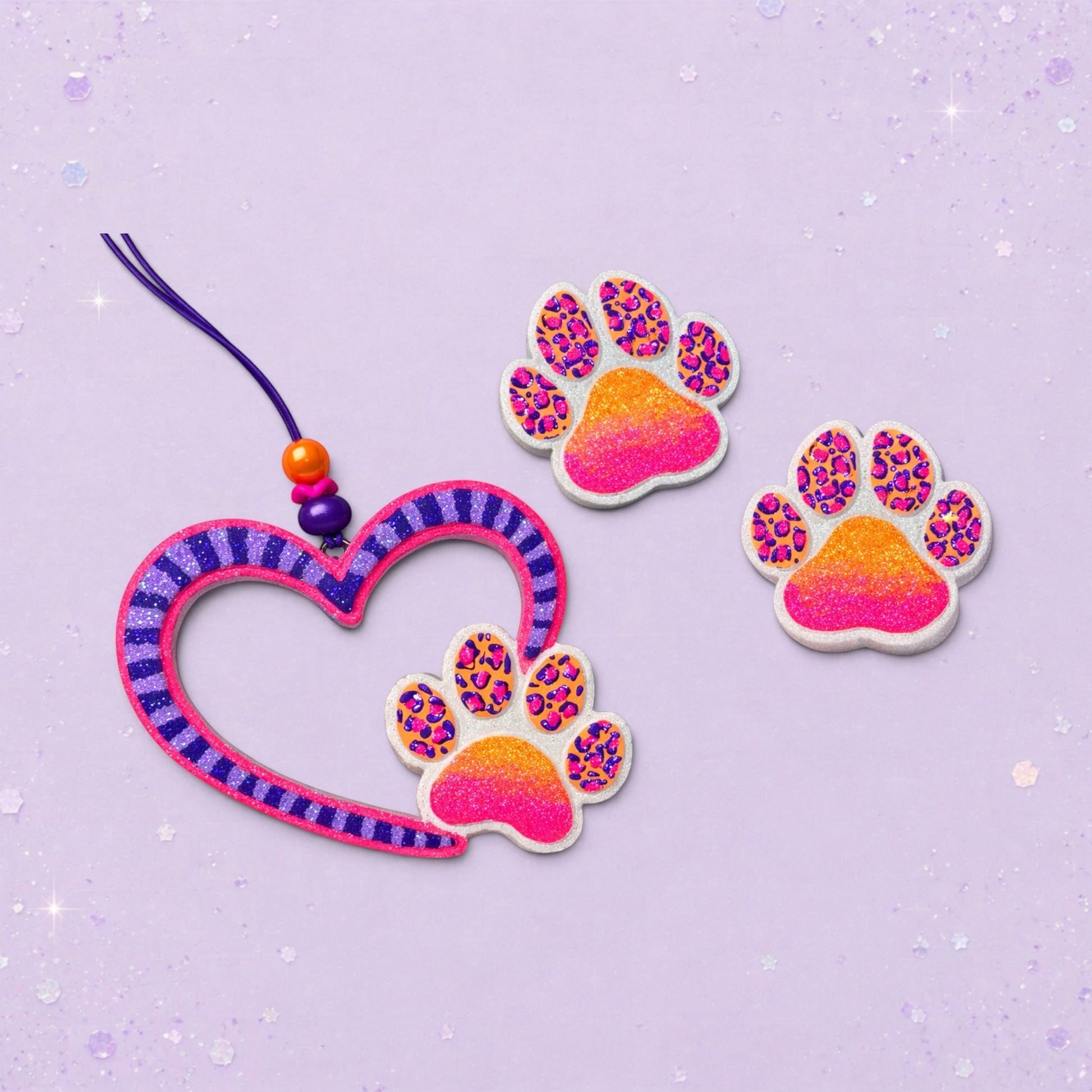 BeFreshie hollow heart shaped freshie with purple stripes and a paw print accent, with two extra paw print freshies.
