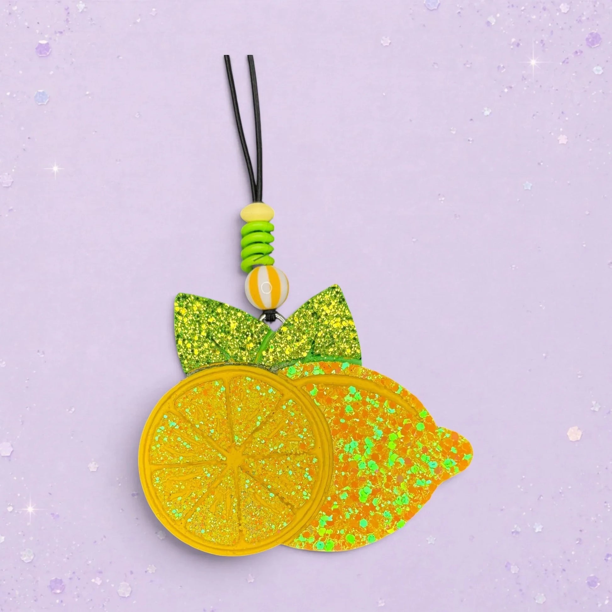 BeFreshie Lemon Freshie car air freshener with glittery yellow lemons and green leaves.