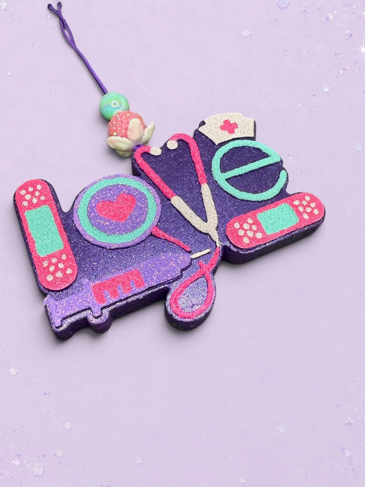 BeFreshie Love Medical Theme freshie featuring purple glitter text, stethoscope, nurse cap, and bandages.