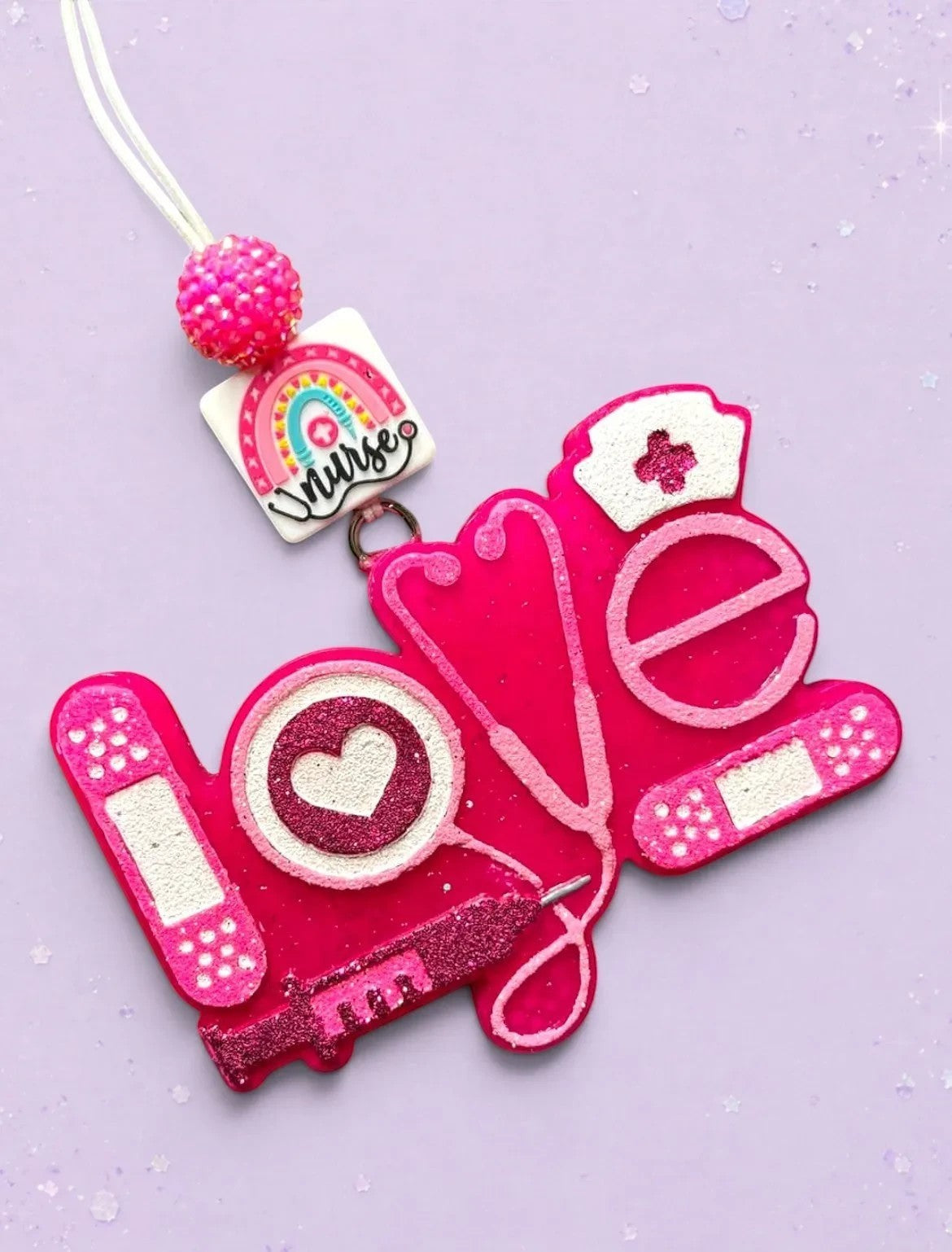 BeFreshie pink "Love" medical theme freshie with stethoscope, syringe, band-aids, and nurse cap charm.