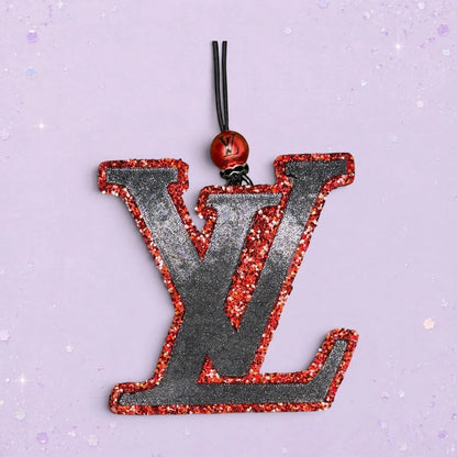 BeFreshie LV freshie air freshener, black with red glitter trim and hanging loop.