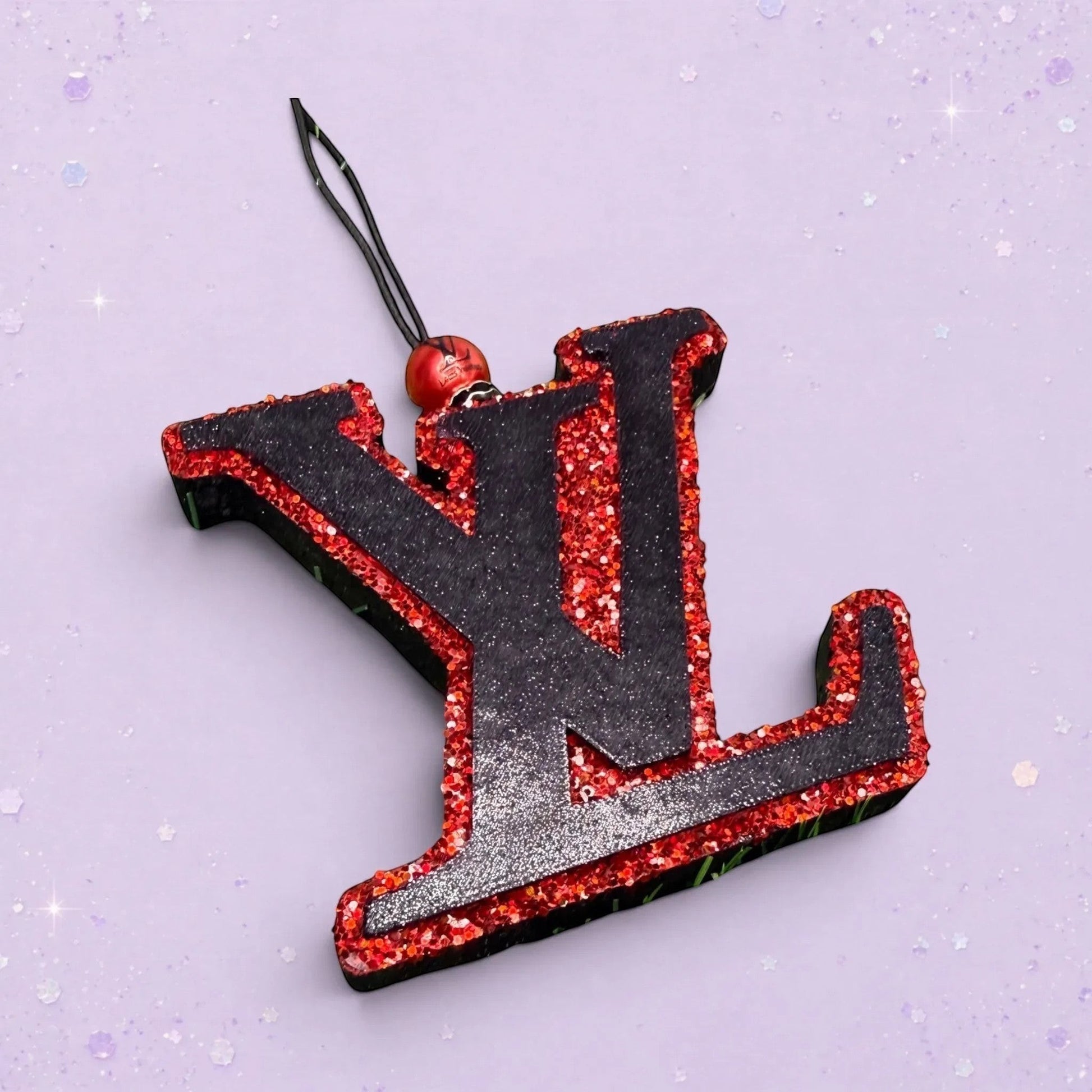 BeFreshie black LV freshie with red glitter trim and hanging loop. Adds personality and fun.