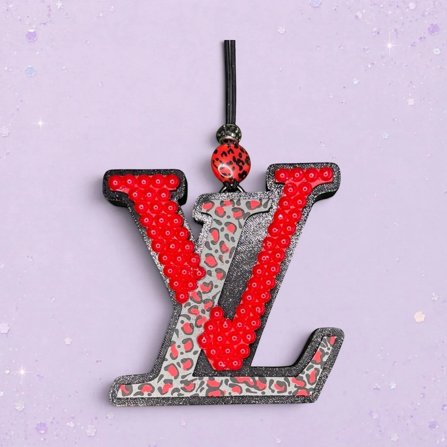 BeFreshie LV freshie with red sequins and leopard print detail. Black glitter trim.