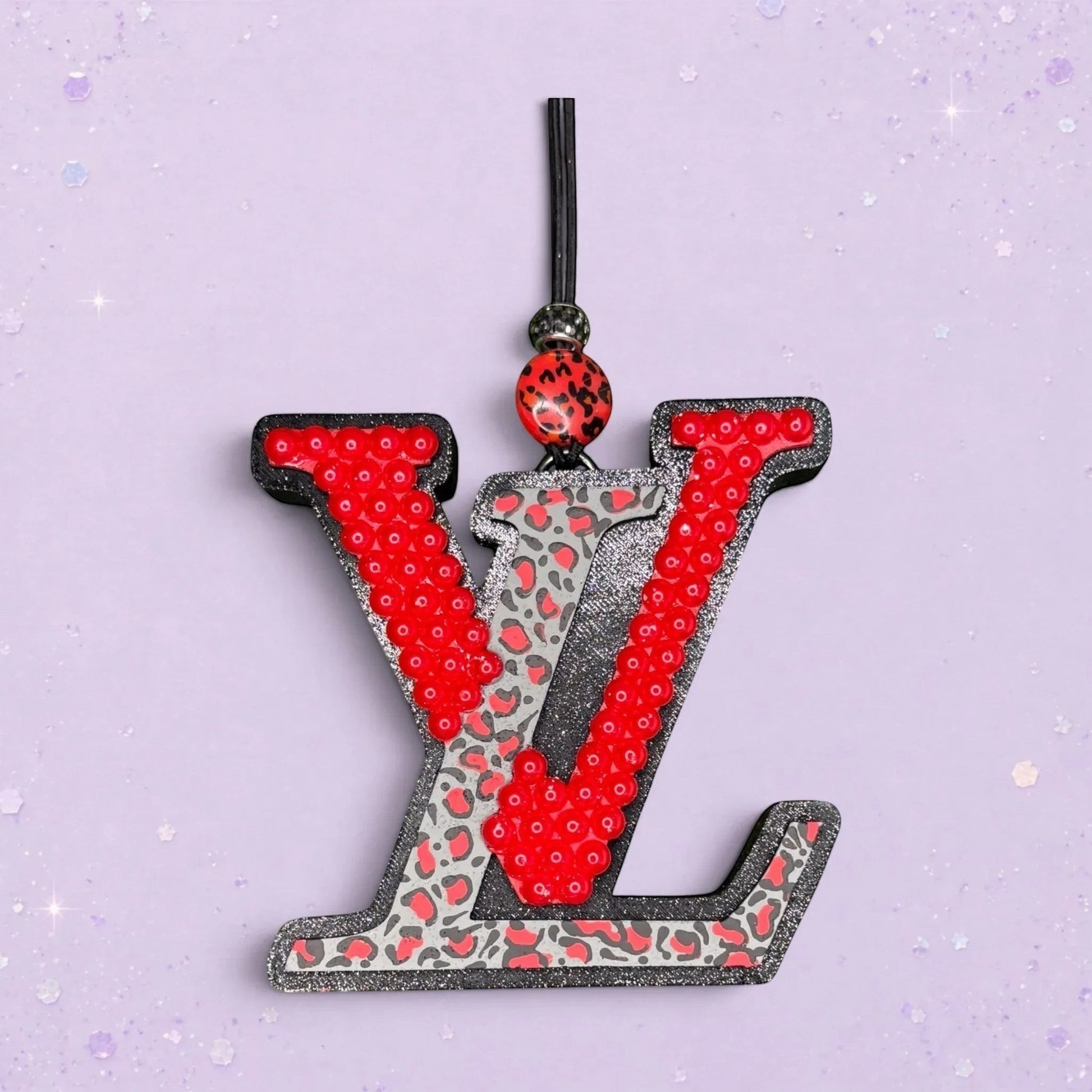 BeFreshie LV freshie with red sequins and leopard print detail. Black glitter trim.