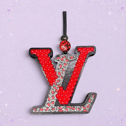 BeFreshie LV freshie with red sequins and leopard print detail. Black glitter trim.