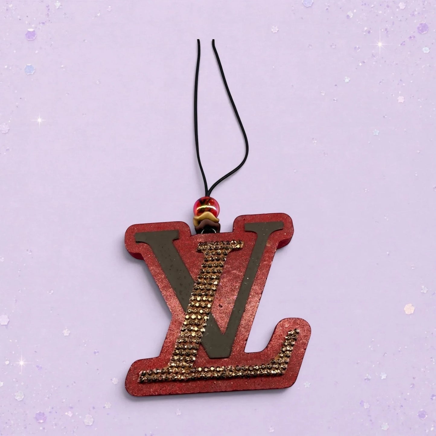 BeFreshie red LV freshie with gold rhinestones and a black cord hanger with beaded accent.