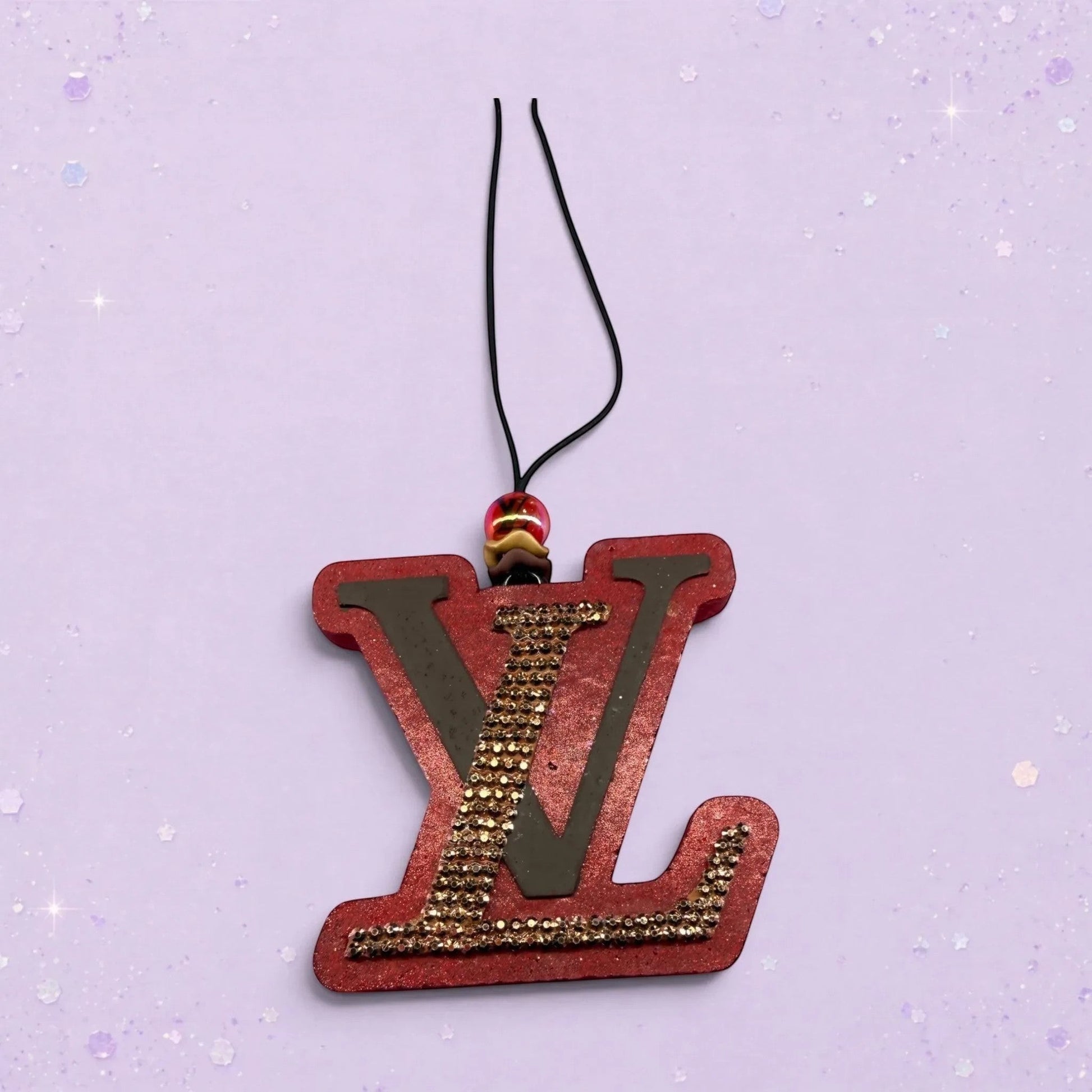 BeFreshie red LV freshie with gold rhinestones and a black cord hanger with beaded accent.