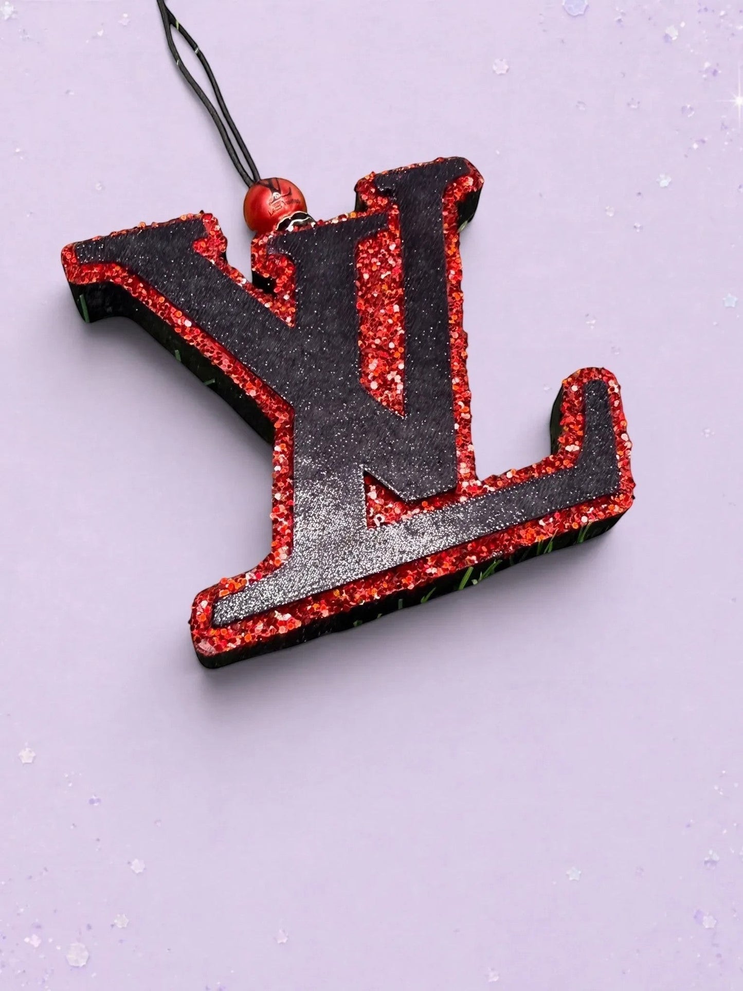 BeFreshie LV freshie car air freshener featuring a black and red glittery logo design with a hanging cord.