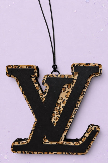 BeFreshie LV freshie car air freshener featuring a black logo layered over a tan and black leopard print background.