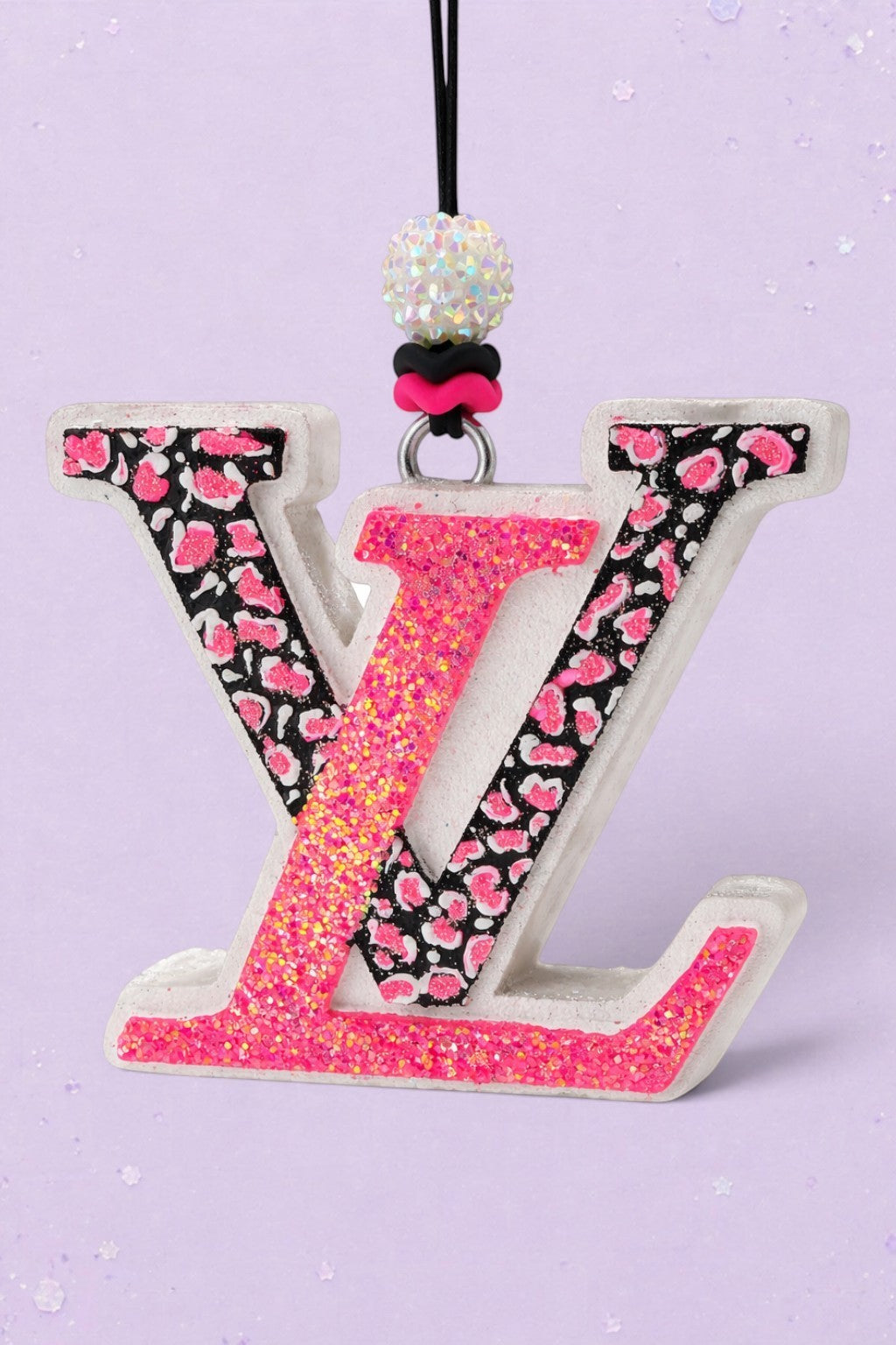 BeFreshie LV freshie car air freshener featuring a pink glitter and black leopard print letter design with beads.
