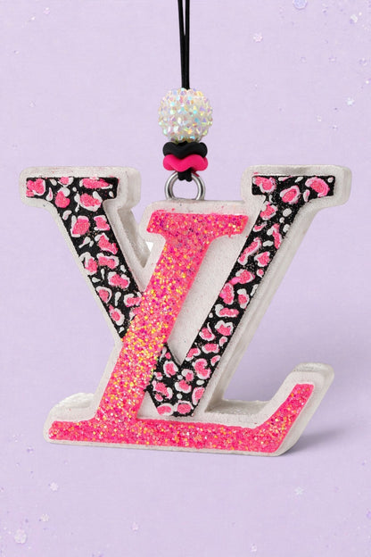BeFreshie LV freshie car air freshener featuring a pink glitter and black leopard print letter design with beads.