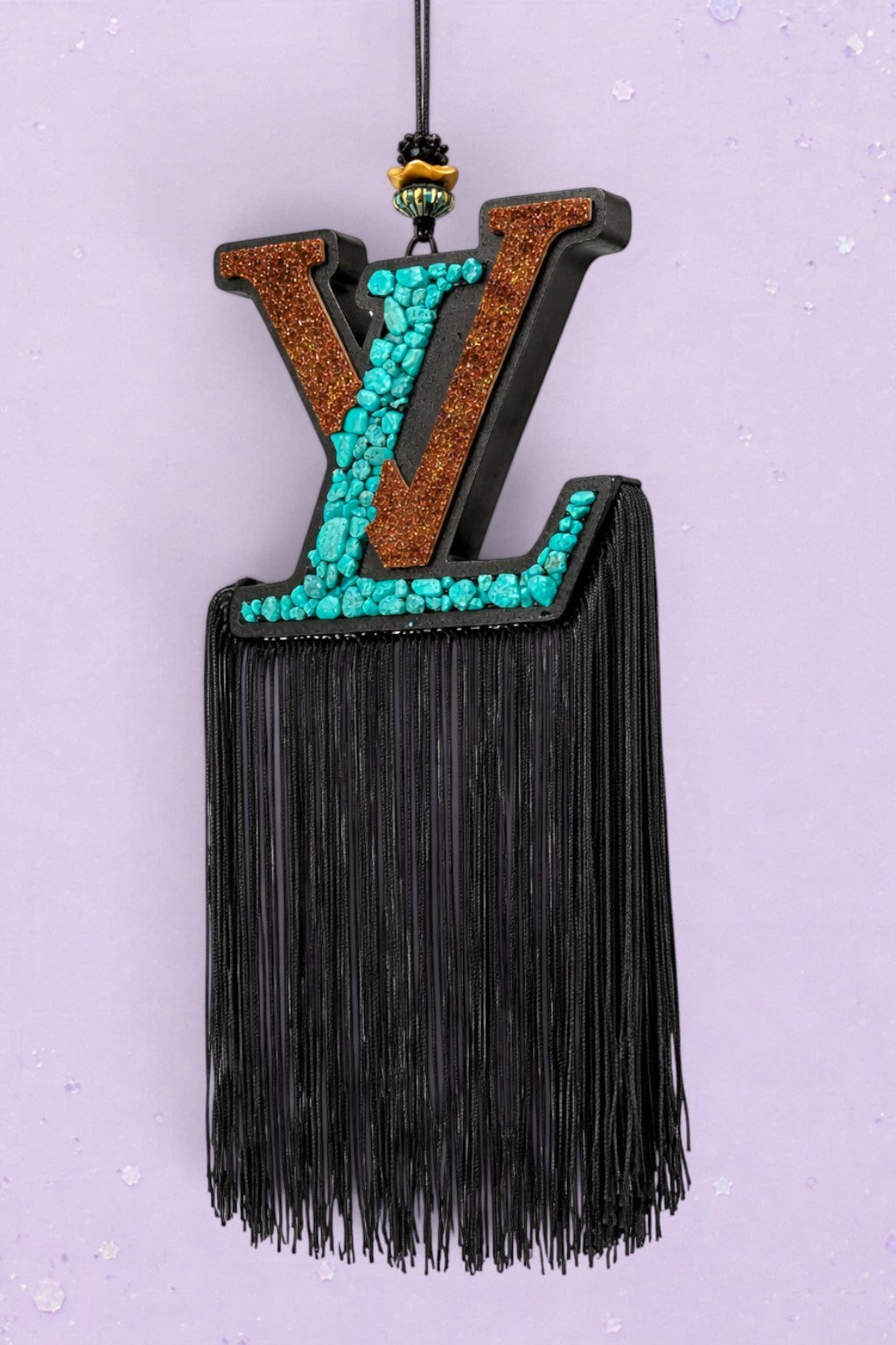 BeFreshie LV logo car air freshener with turquoise stone inlay, copper glitter, and long black fringe tassel.