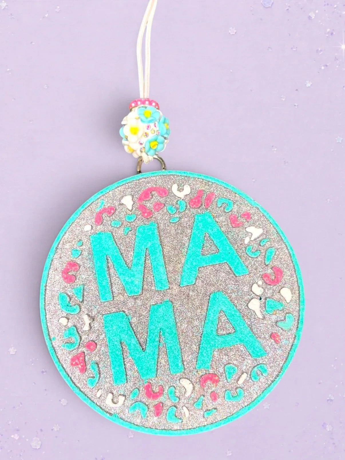 BeFreshie Mama Circle Freshie with turquoise letters and leopard print accents on glitter background.