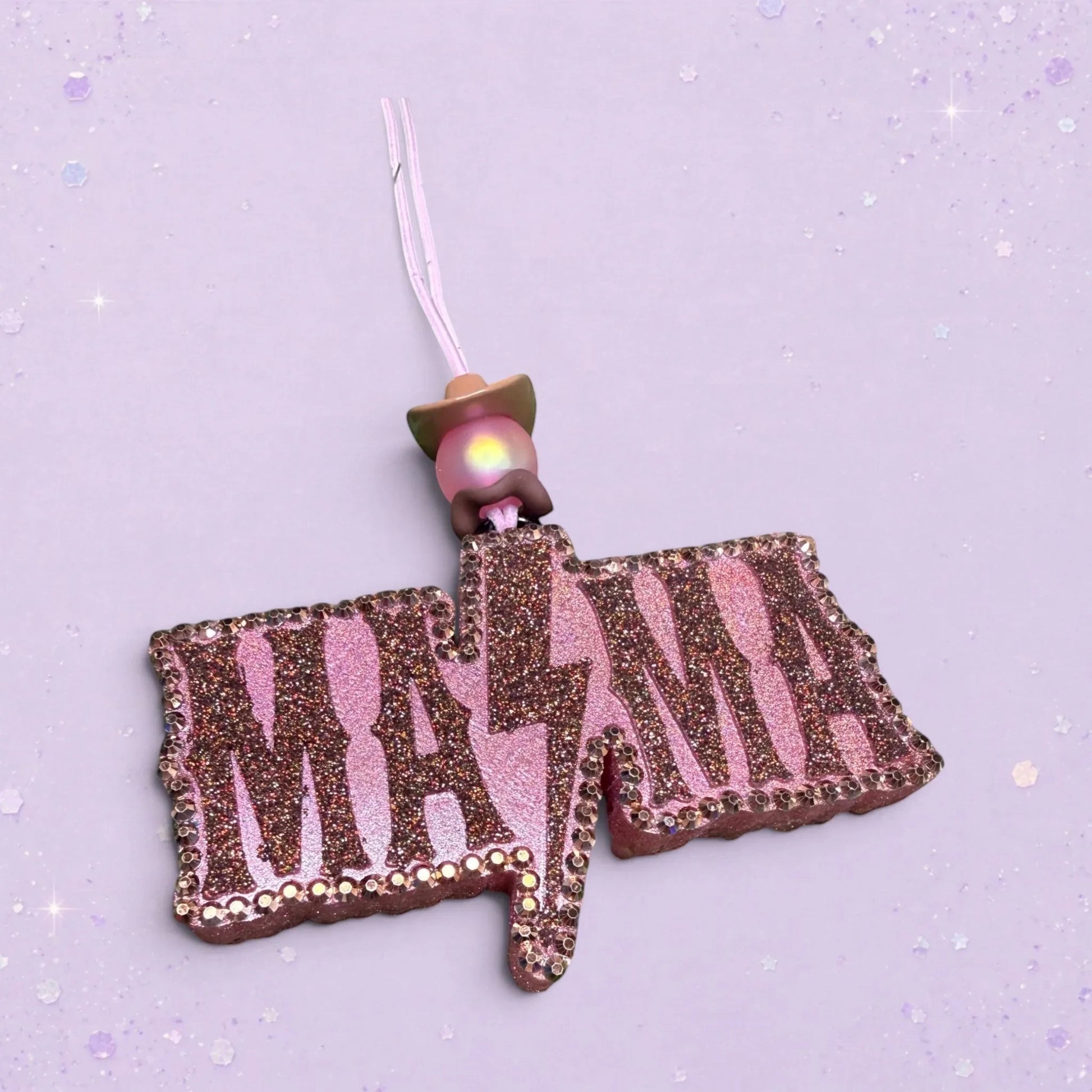 BeFreshie Mama lightning bolt car freshie, pink glitter with rhinestone trim and a cowboy hat charm.