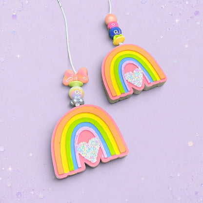 BeFreshie mini rainbow car freshies with glitter hearts and Whirly Curlz clips on a light purple background