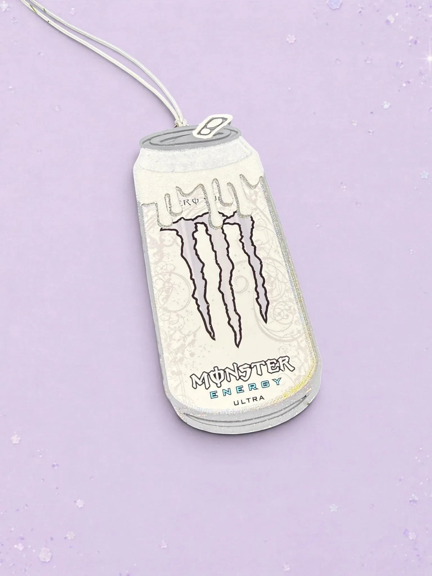 BeFreshie custom Monster Energy Ultra can car air freshener with white glitter finish on a light purple background