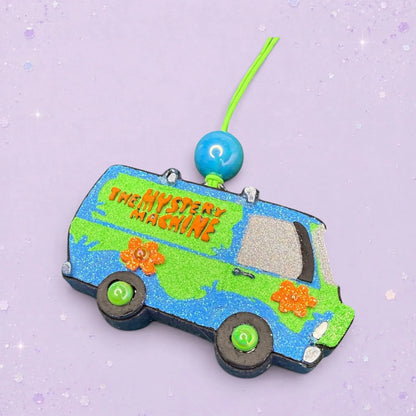 BeFreshie The Mystery Machine Scooby Doo freshie, a blue and green glitter van with orange flower accents and a blue bead.