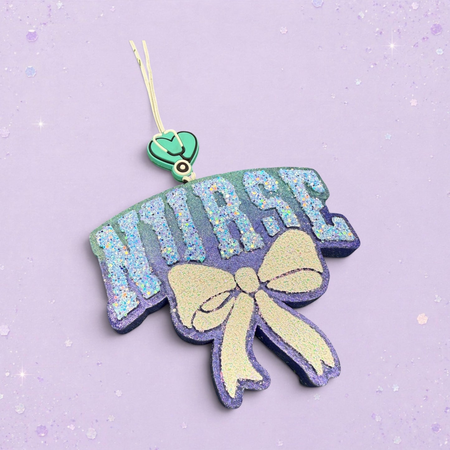 BeFreshie glittery purple and blue NURSE freshie with a pale yellow bow and stethoscope charm.