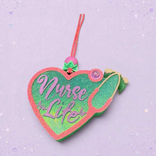 BeFreshie heart-shaped nurse life freshie with stethoscope design, pink glitter trim, green and purple lettering.