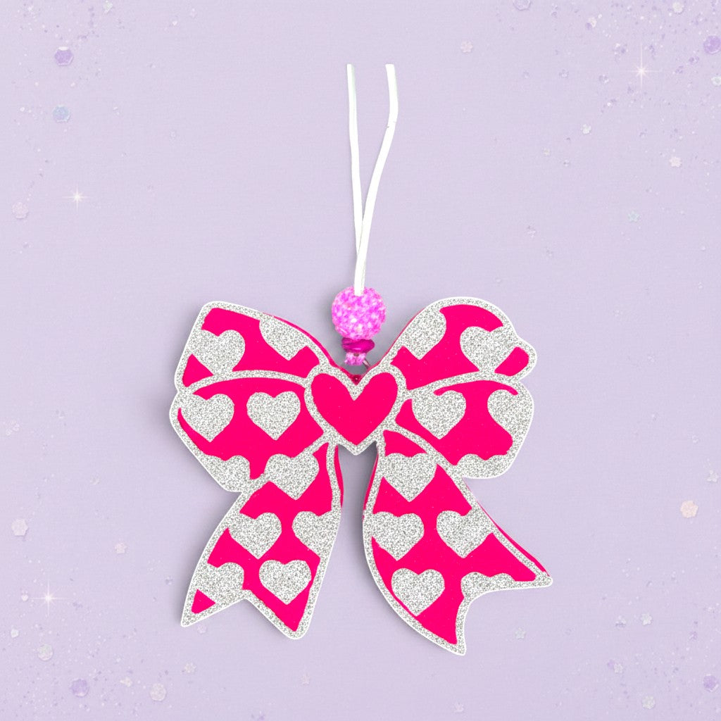 BeFreshie pink bow freshie with white hearts and a sparkly bead accent.