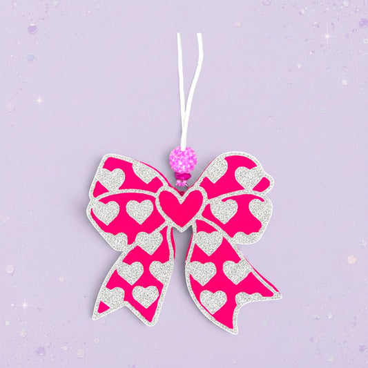 BeFreshie pink bow freshie with white hearts and a sparkly bead accent.