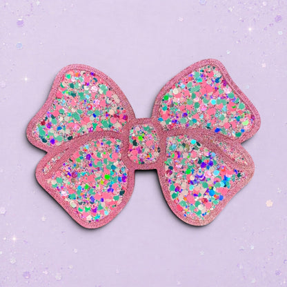 BeFreshie pink glitter bow with multi-colored confetti accents. Feminine and sparkly accessory.