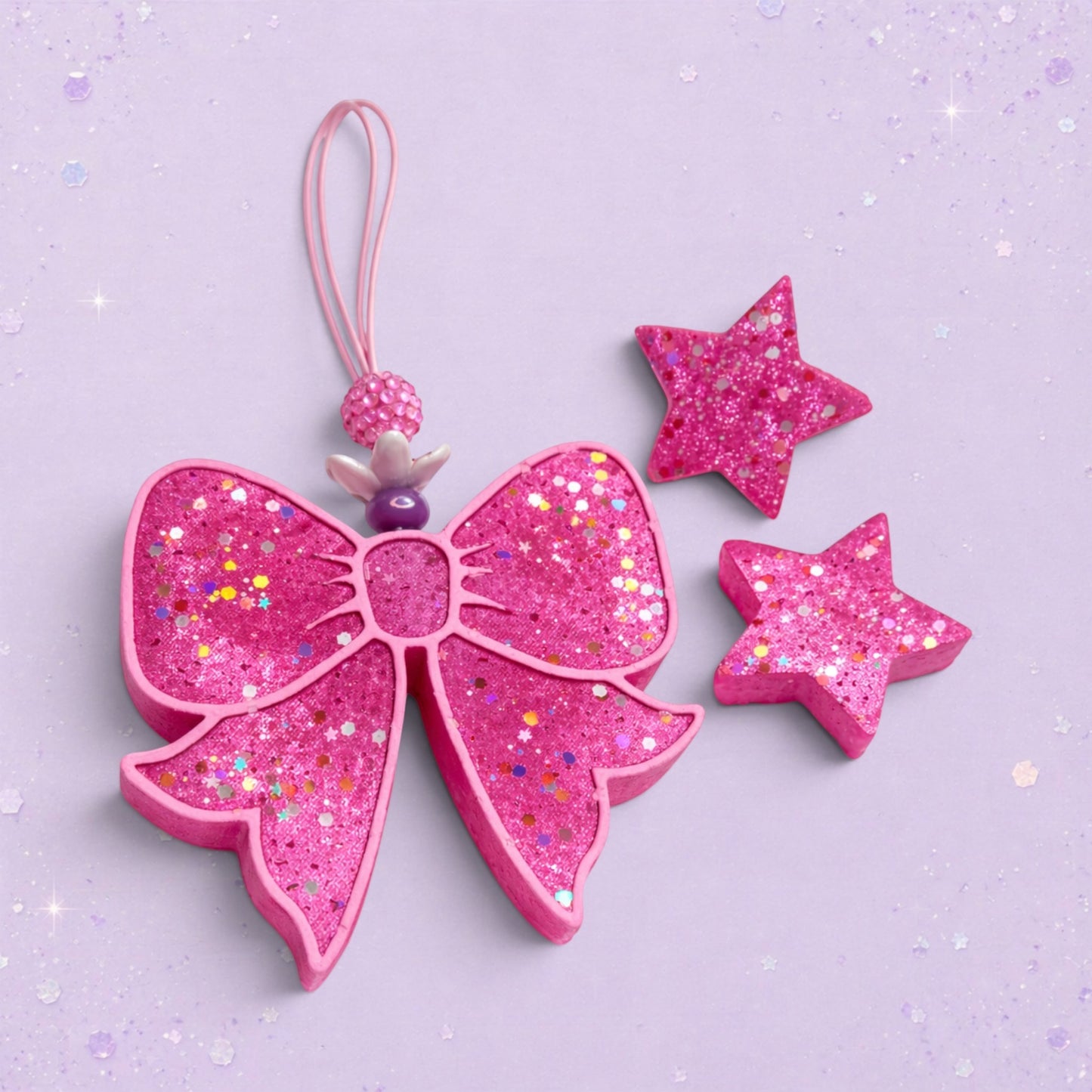 BeFreshie pink glitter bow freshie with matching stars. A fun accessory for adding personality.