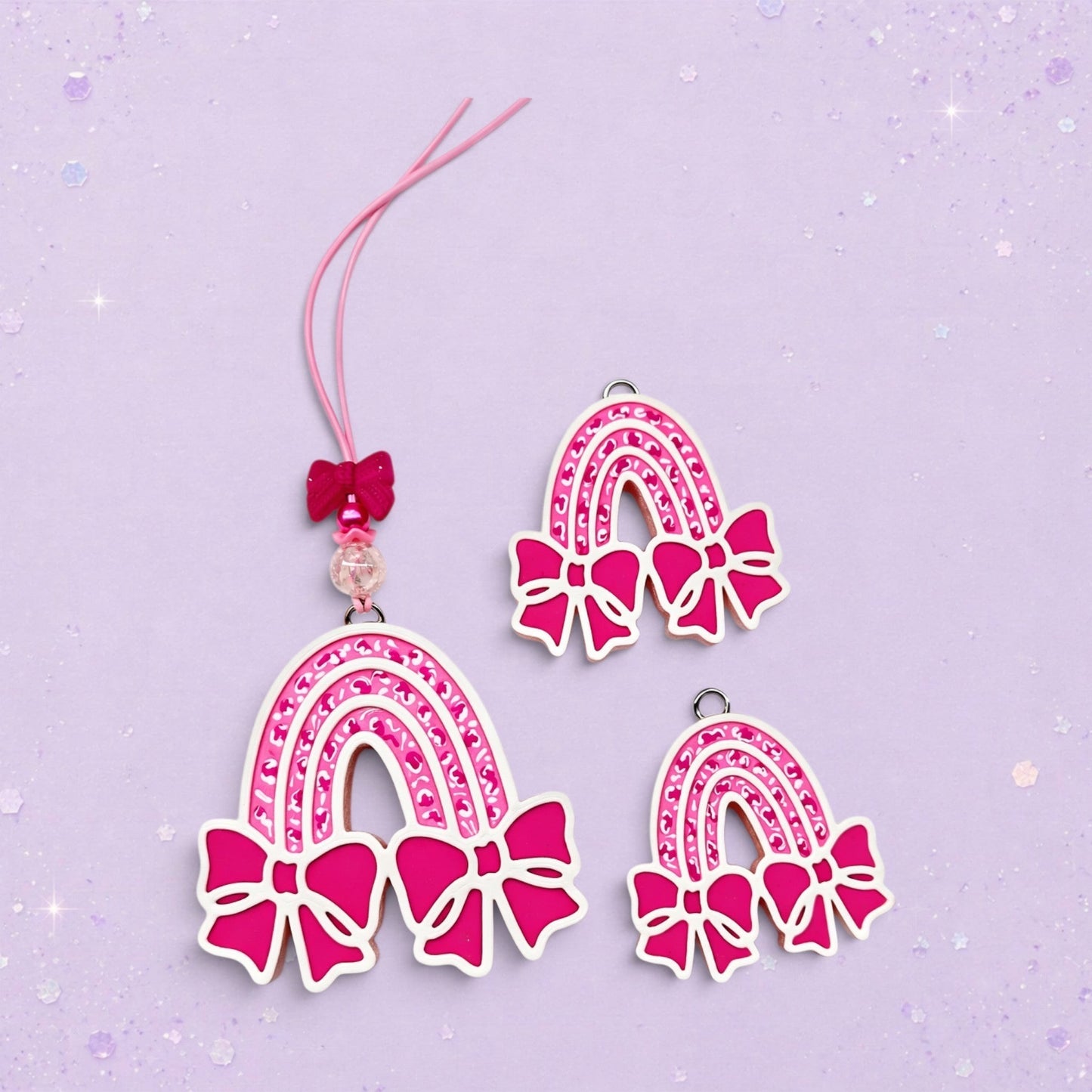 BeFreshie pink rainbow freshie with bows and glitter detail. Includes hanging string and bead.