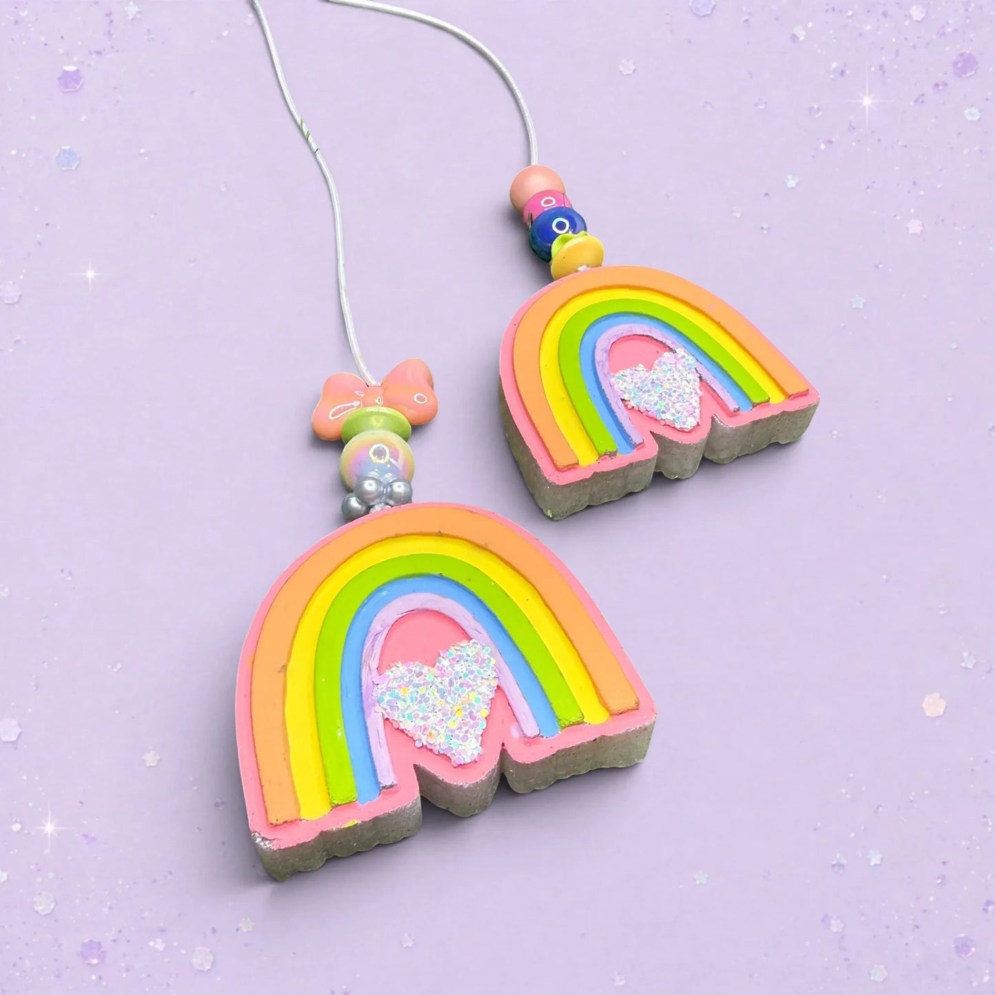 BeFreshie Rainbow Small freshie car air freshener with glitter heart and colorful beaded string on purple background
