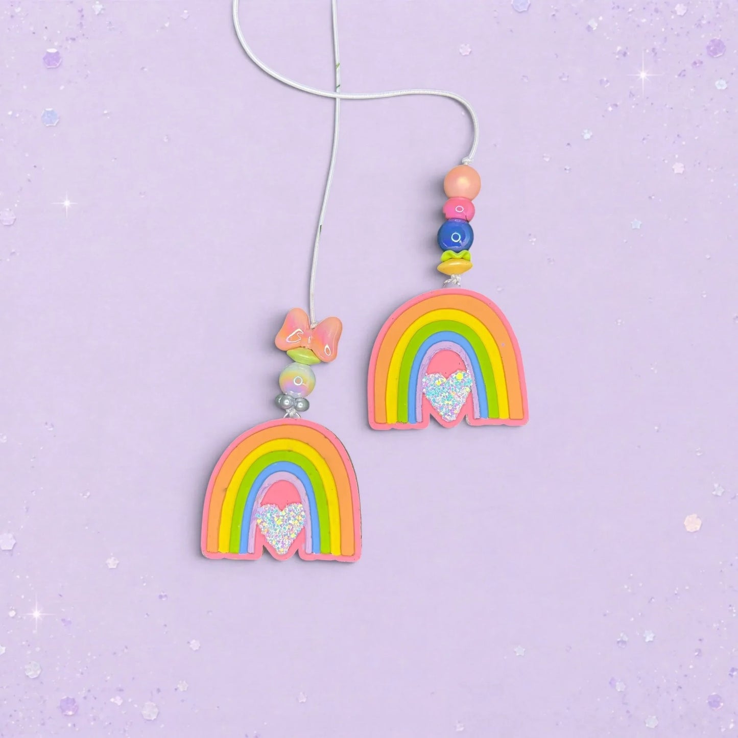 BeFreshie Rainbow Small freshie car air fresheners with colorful beads and glitter heart accents on a purple background